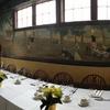 A view of the head table next to the warm fire place and cake table.